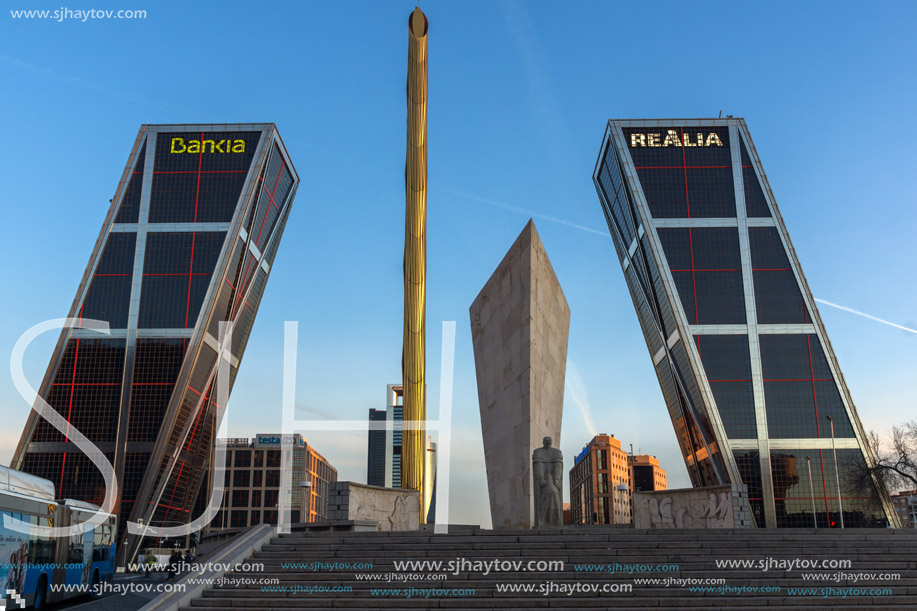 MADRID, SPAIN - JANUARY 23, 2018:  Sunrise view of Gate of Europe (KIO Towers) and Monument to Jose Calvo Sotelo at Paseo de la Castellana street in City of Madrid, Spain