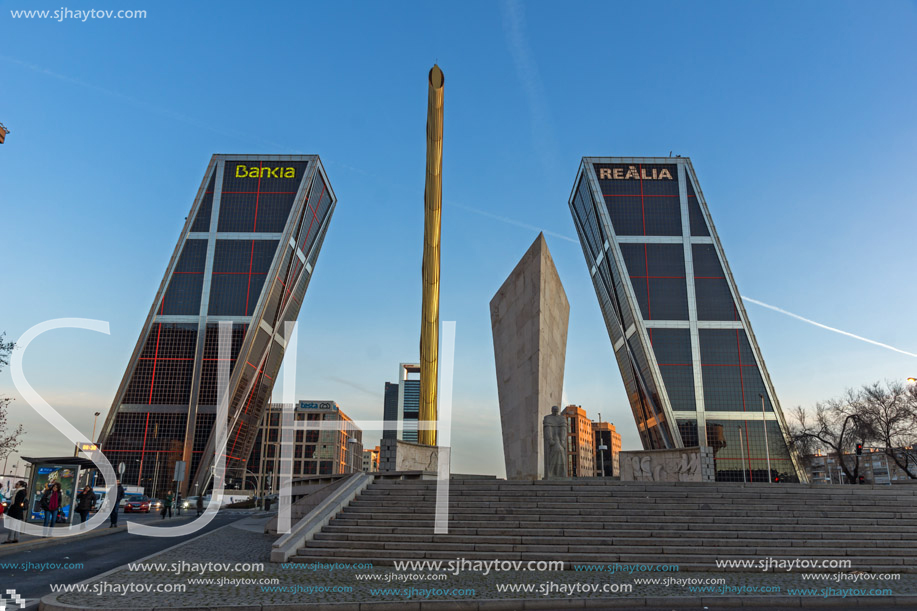 MADRID, SPAIN - JANUARY 23, 2018:  Sunrise view of Gate of Europe (KIO Towers) and Monument to Jose Calvo Sotelo at Paseo de la Castellana street in City of Madrid, Spain