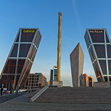 MADRID, SPAIN - JANUARY 23, 2018:  Sunrise view of Gate of Europe (KIO Towers) and Monument to Jose Calvo Sotelo at Paseo de la Castellana street in City of Madrid, Spain