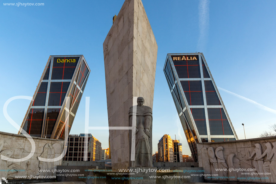 MADRID, SPAIN - JANUARY 23, 2018:  Sunrise view of Gate of Europe (KIO Towers) and Monument to Jose Calvo Sotelo at Paseo de la Castellana street in City of Madrid, Spain