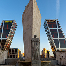 MADRID, SPAIN - JANUARY 23, 2018:  Sunrise view of Gate of Europe (KIO Towers) and Monument to Jose Calvo Sotelo at Paseo de la Castellana street in City of Madrid, Spain