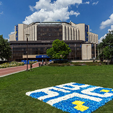 SOFIA, BULGARIA -MAY 20, 2018:  Flower garden and National Palace of Culture in Sofia, Bulgaria