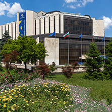 SOFIA, BULGARIA -MAY 20, 2018:  Flower garden and National Palace of Culture in Sofia, Bulgaria