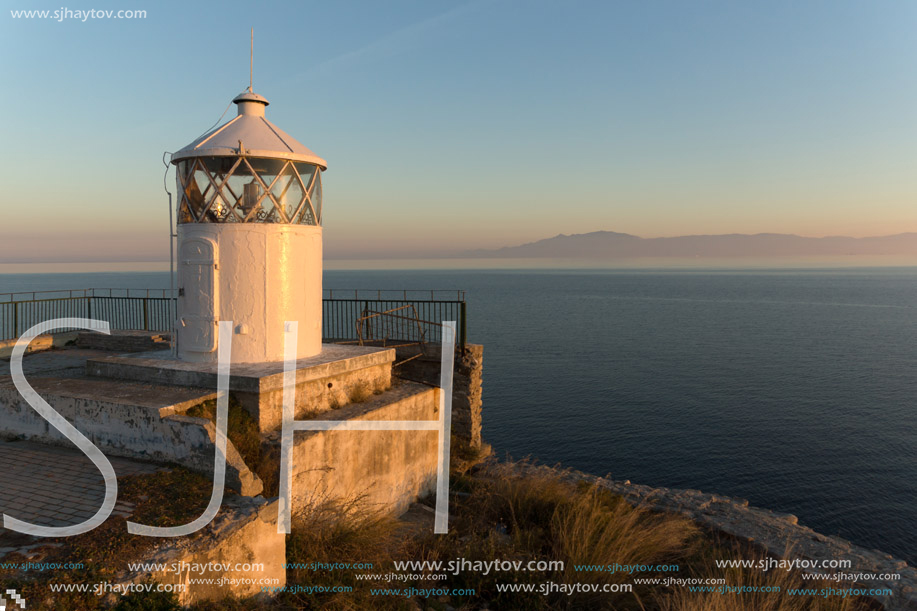 KAVALA, GREECE - DECEMBER 27, 2015: Sunset over Lighthouse in Kavala, East Macedonia and Thrace, Greece