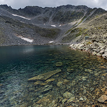 Amazing panorama of Ledenoto (Ice) Lake and clouds over Musala Peak, Rila mountain, Bulgaria