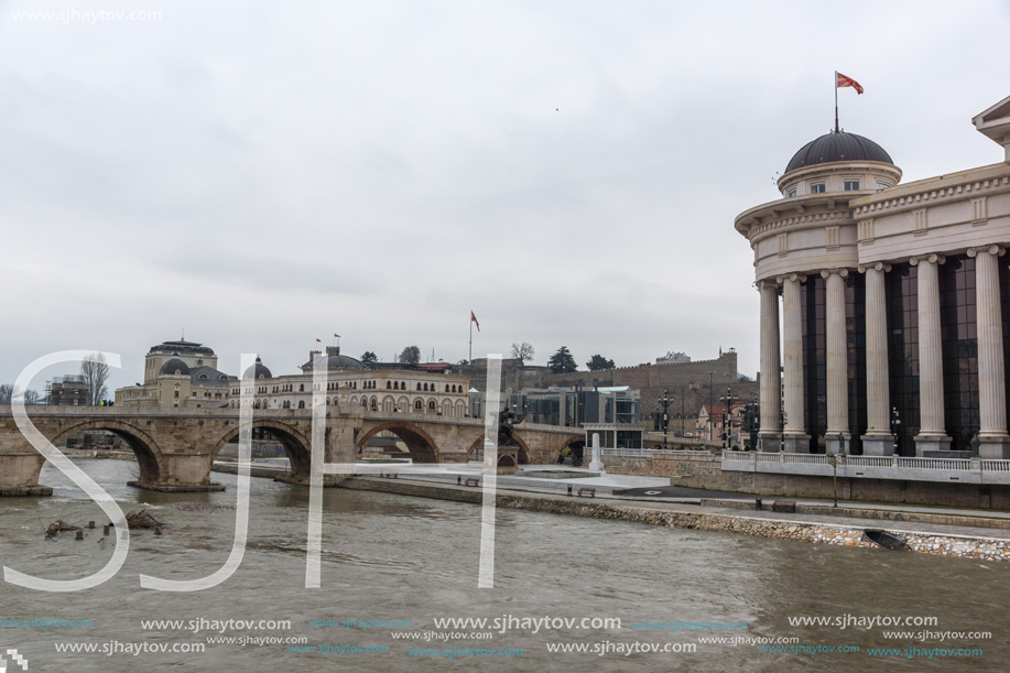 SKOPJE, REPUBLIC OF MACEDONIA - FEBRUARY 24, 2018: Skopje City Center - Archaeological Museum, Old Stone bridge and Vardar River, Republic of Macedonia