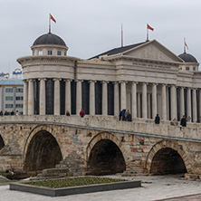 SKOPJE, REPUBLIC OF MACEDONIA - FEBRUARY 24, 2018:  Skopje City Center, Old Stone Bridge, Vardar River and Archaeological Museum, Republic of Macedonia