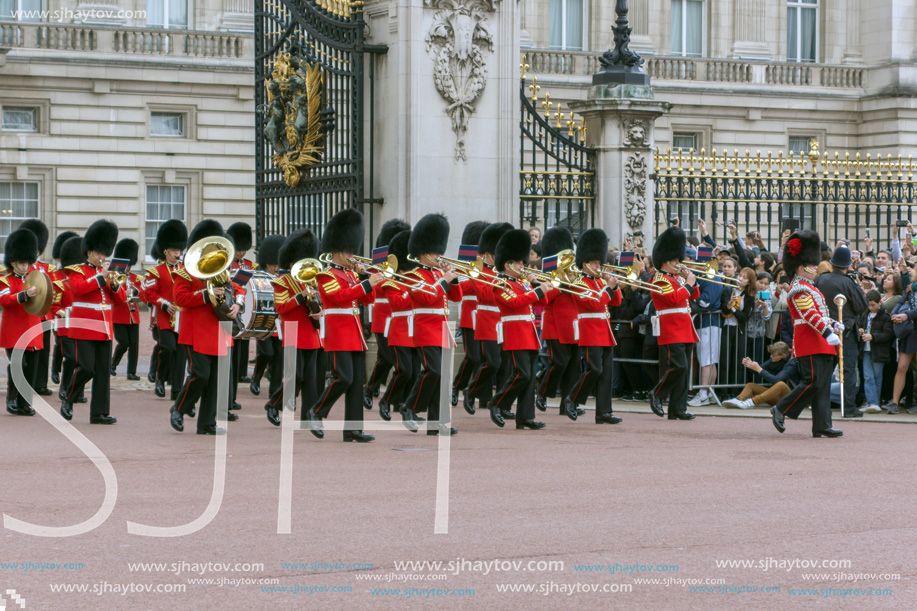 LONDON, ENGLAND - JUNE 17, 2016: British Royal guards perform the Changing of the Guard in Buckingham Palace, London, England, Great Britain