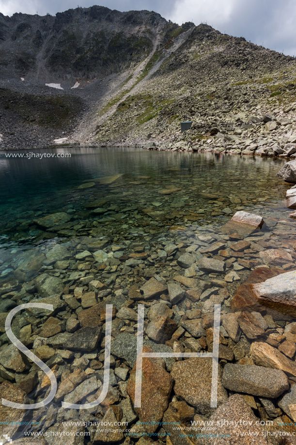 Amazing panoramic view of Ledenoto (Ice) Lake and clouds over Musala Peak, Rila mountain, Bulgaria
