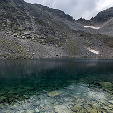 Amazing panoramic view of Ledenoto (Ice) Lake and clouds over Musala Peak, Rila mountain, Bulgaria