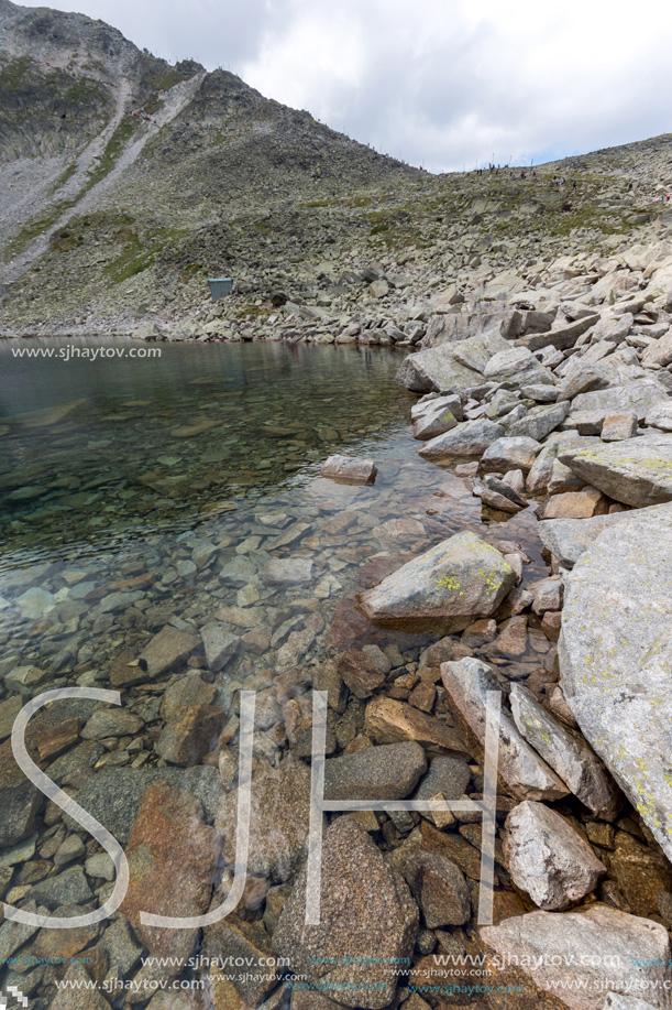 Amazing panoramic view of Ledenoto (Ice) Lake and clouds over Musala Peak, Rila mountain, Bulgaria