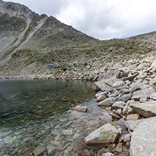 Amazing panoramic view of Ledenoto (Ice) Lake and clouds over Musala Peak, Rila mountain, Bulgaria