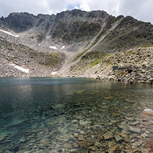 Amazing panoramic view of Ledenoto (Ice) Lake and clouds over Musala Peak, Rila mountain, Bulgaria
