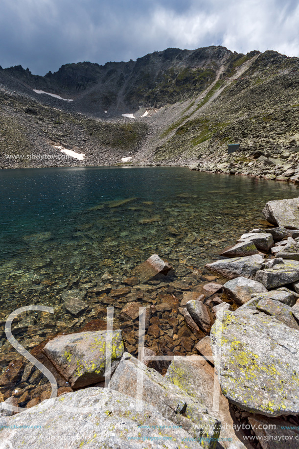 Amazing panoramic view of Ledenoto (Ice) Lake and clouds over Musala Peak, Rila mountain, Bulgaria