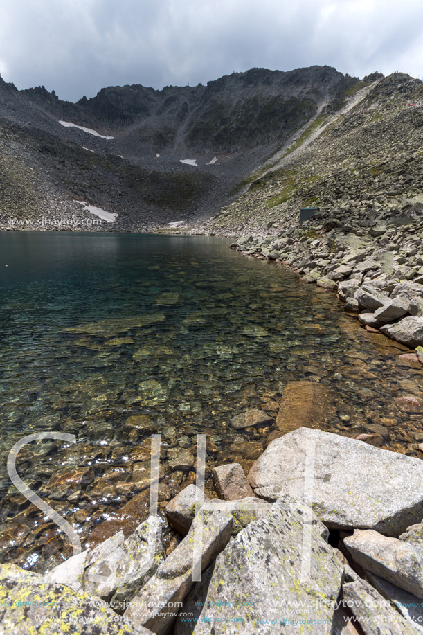 Amazing panoramic view of Ledenoto (Ice) Lake and clouds over Musala Peak, Rila mountain, Bulgaria