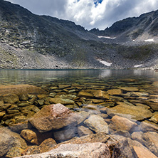 Amazing panoramic view of Ledenoto (Ice) Lake and clouds over Musala Peak, Rila mountain, Bulgaria