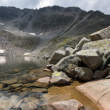 Amazing panoramic view of Ledenoto (Ice) Lake and clouds over Musala Peak, Rila mountain, Bulgaria