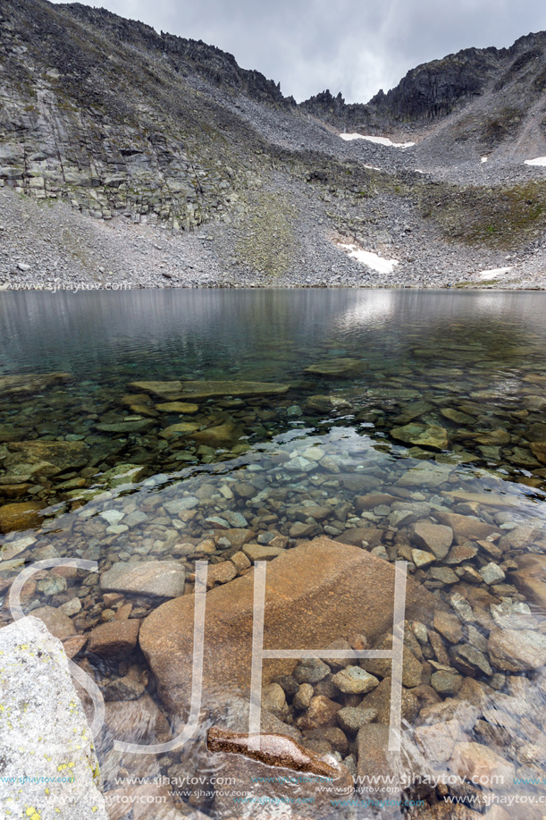 Amazing panoramic view of Ledenoto (Ice) Lake and clouds over Musala Peak, Rila mountain, Bulgaria
