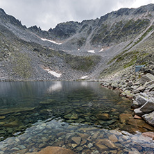 Amazing panoramic view of Ledenoto (Ice) Lake and clouds over Musala Peak, Rila mountain, Bulgaria