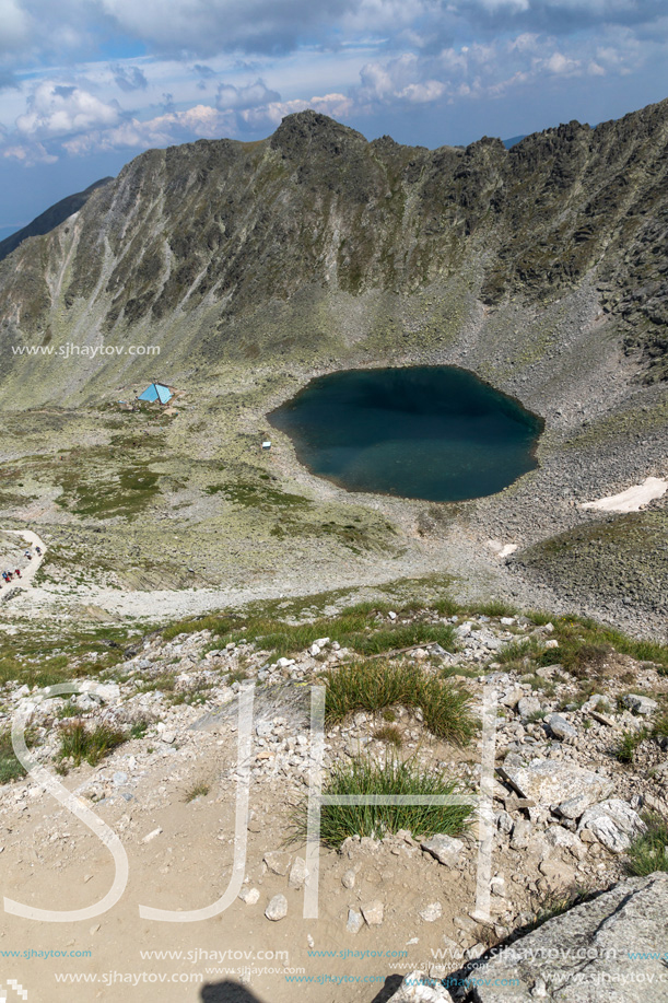 Amazing panoramic view of Ledenoto (Ice) Lake and clouds over Musala Peak, Rila mountain, Bulgaria