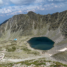Amazing panoramic view of Ledenoto (Ice) Lake and clouds over Musala Peak, Rila mountain, Bulgaria