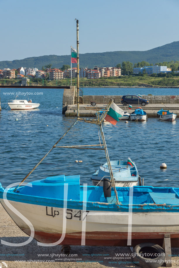 TSAREVO, BULGARIA - JUNE 28, 2013: Sunset at Old boat at the port town of Tsarevo, Burgas Region, Bulgaria