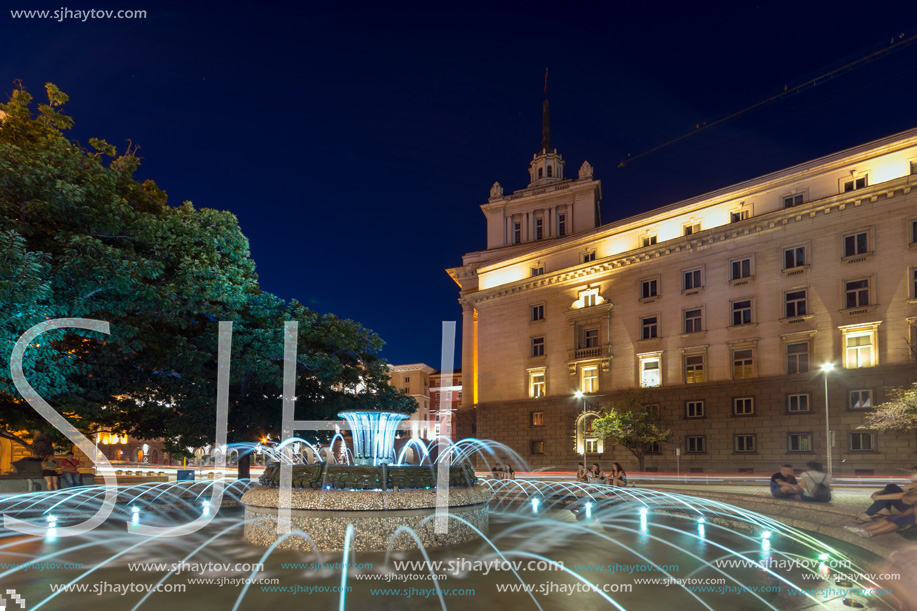 SOFIA, BULGARIA - JULY 21, 2017: Night photo of Fountain in front of The Building of the Presidency and Former Communist Party House in Sofia, Bulgaria