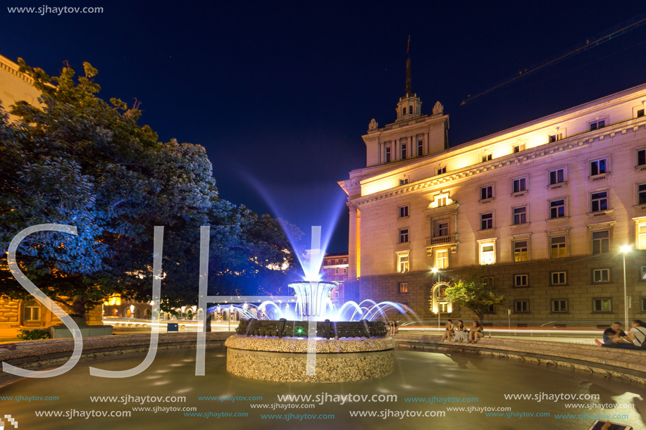 SOFIA, BULGARIA - JULY 21, 2017: Night photo of Fountain in front of The Building of the Presidency and Former Communist Party House in Sofia, Bulgaria