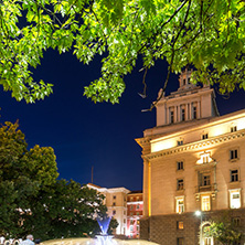 SOFIA, BULGARIA - JULY 21, 2017: Night photo of Fountain in front of The Building of the Presidency and Former Communist Party House in Sofia, Bulgaria