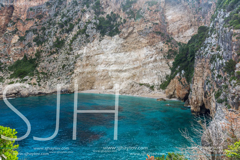 Blue water and rocks of beach at Zakynthos island, Greece