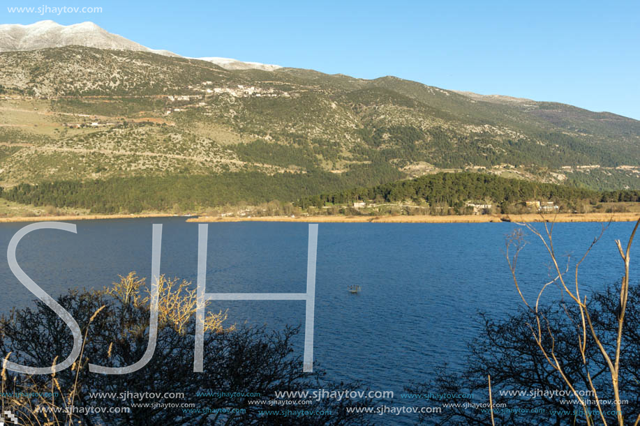 IOANNINA, GREECE - DECEMBER 27, 2014:  Amazing winter Landscape of Lake Pamvotida and Pindus mountain from city of Ioannina, Epirus, Greece
