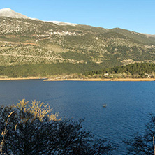 IOANNINA, GREECE - DECEMBER 27, 2014:  Amazing winter Landscape of Lake Pamvotida and Pindus mountain from city of Ioannina, Epirus, Greece