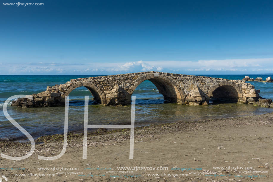 Seascape with medieval bridge in the water at Argassi beach, Zakynthos island, Greece