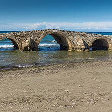 Seascape with medieval bridge in the water at Argassi beach, Zakynthos island, Greece