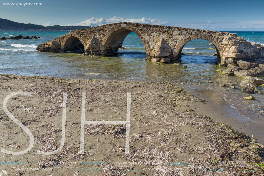 Seascape with medieval bridge in the water at Argassi beach, Zakynthos island, Greece