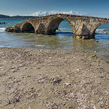 Seascape with medieval bridge in the water at Argassi beach, Zakynthos island, Greece