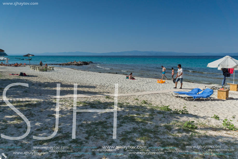 NEA FOKEA, KASSANDRA, CHALKIDIKI, GREECE - JUNE 24, 2014: Beach of Nea Fokea at Kassandra peninsula, Chalkidiki, Central Macedonia, Greece