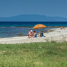 NEA FOKEA, KASSANDRA, CHALKIDIKI, GREECE - JUNE 24, 2014: Beach of Nea Fokea at Kassandra peninsula, Chalkidiki, Central Macedonia, Greece