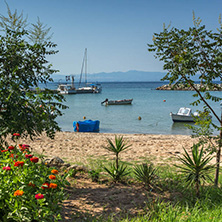 NEA FOKEA, KASSANDRA, CHALKIDIKI, GREECE - JUNE 24, 2014: Beach of Nea Fokea at Kassandra peninsula, Chalkidiki, Central Macedonia, Greece