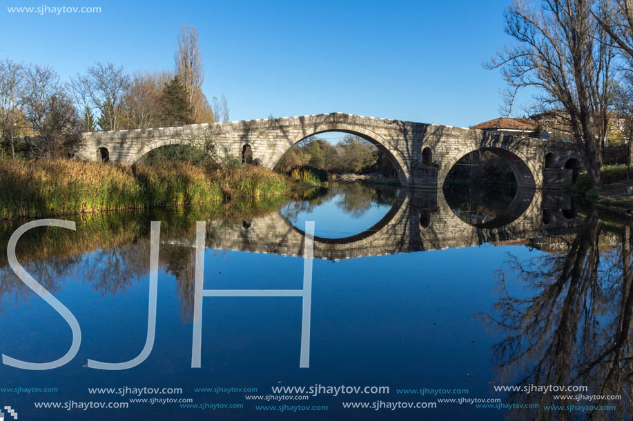 Autumn view of Kadin most - a 15th-century stone arch bridge over the Struma River at Nevestino, Kyustendil Province, Bulgaria