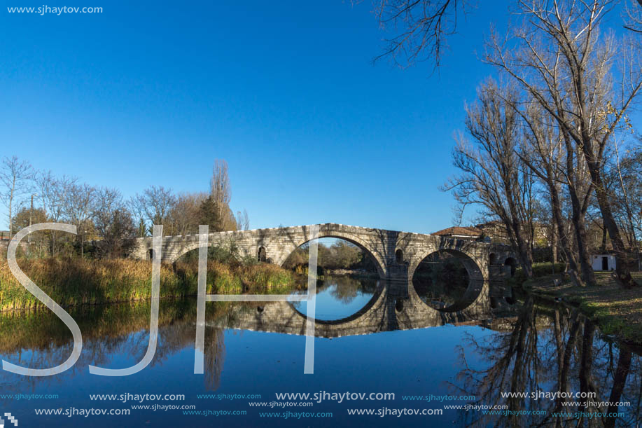 Autumn view of Kadin most - a 15th-century stone arch bridge over the Struma River at Nevestino, Kyustendil Province, Bulgaria