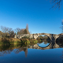 Autumn view of Kadin most - a 15th-century stone arch bridge over the Struma River at Nevestino, Kyustendil Province, Bulgaria