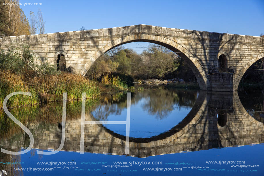 Autumn view of Kadin most - a 15th-century stone arch bridge over the Struma River at Nevestino, Kyustendil Province, Bulgaria