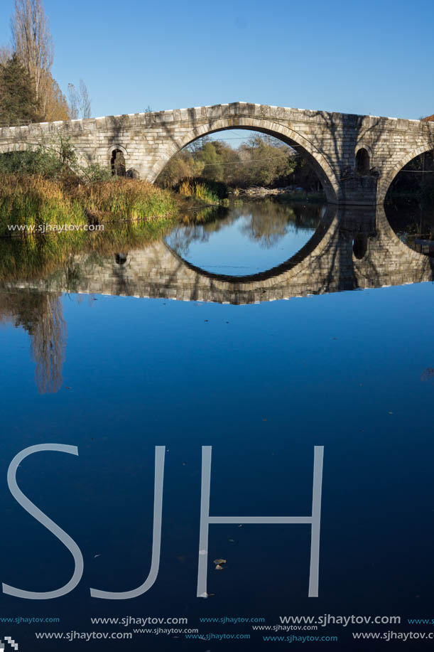 Autumn view of Kadin most - a 15th-century stone arch bridge over the Struma River at Nevestino, Kyustendil Province, Bulgaria