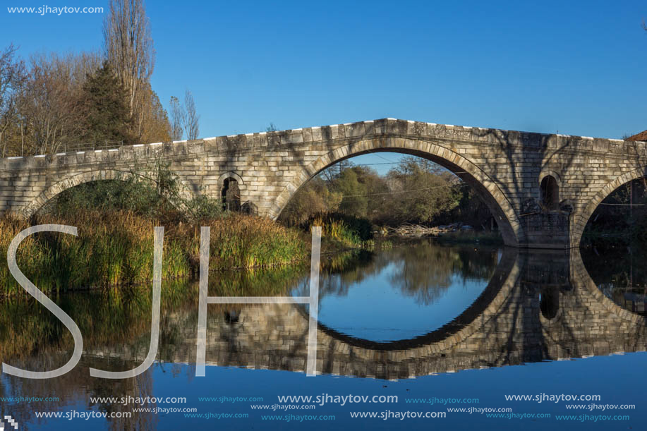 Autumn view of Kadin most - a 15th-century stone arch bridge over the Struma River at Nevestino, Kyustendil Province, Bulgaria