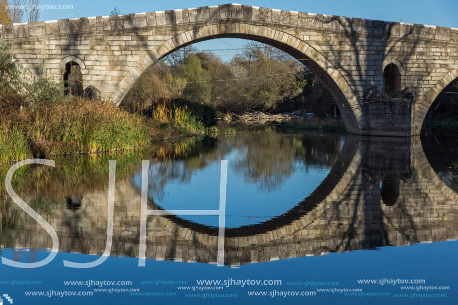 Autumn view of Kadin most - a 15th-century stone arch bridge over the Struma River at Nevestino, Kyustendil Province, Bulgaria