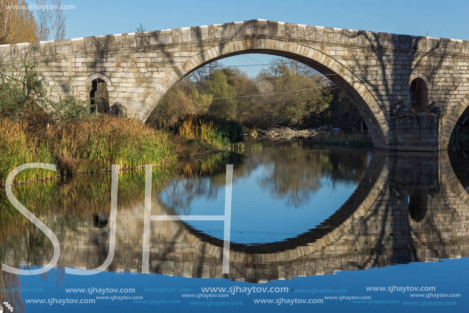 Autumn view of Kadin most - a 15th-century stone arch bridge over the Struma River at Nevestino, Kyustendil Province, Bulgaria