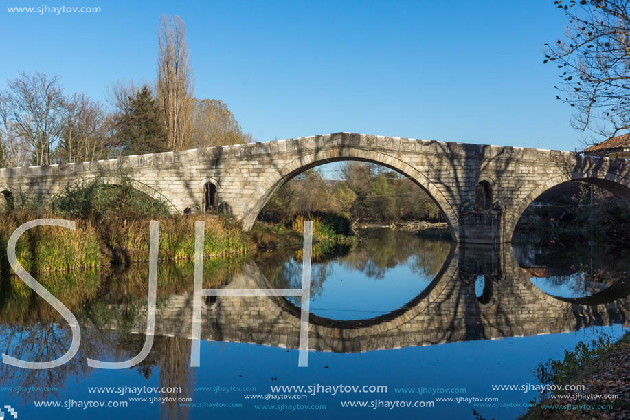 Autumn view of Kadin most - a 15th-century stone arch bridge over the Struma River at Nevestino, Kyustendil Province, Bulgaria