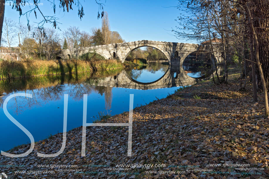 Autumn view of Kadin most - a 15th-century stone arch bridge over the Struma River at Nevestino, Kyustendil Province, Bulgaria