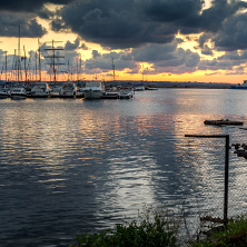 SOZOPOL, BULGARIA - JULY 12, 2016: Sunset at the port of Sozopol, Burgas Region, Bulgaria